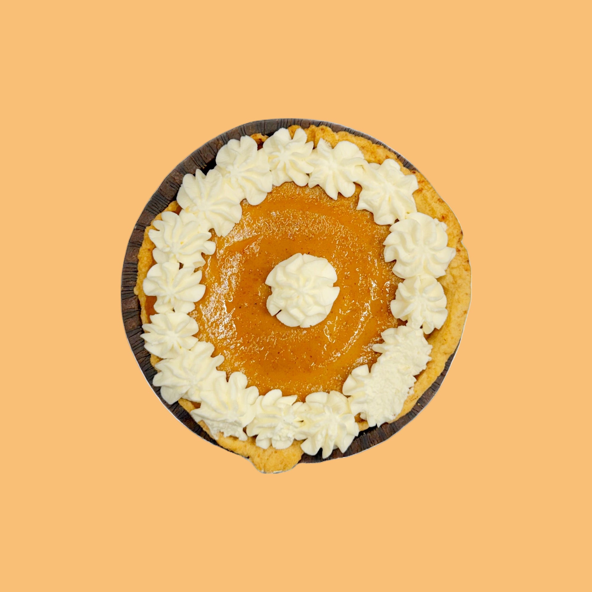 Pumpkin pie with white whipped cream on a orange background